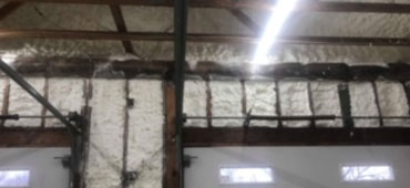 Garage doors surrounded by four inches open cell